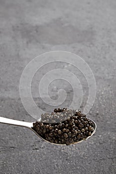 Black caviar close up isolated black background