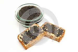 Black caviar in a jar and bread