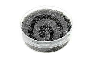 Black caviar in a plastic container