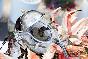 Black caviar served with seafood