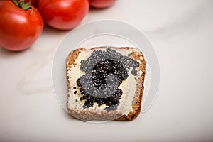 Black caviar on a slice of bread