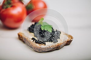 Black caviar on a slice of bread