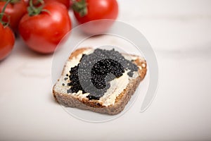 Black caviar on a slice of bread