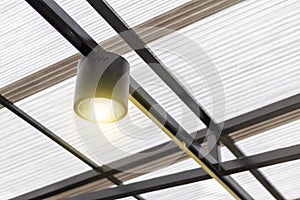 A black ceiling light with warn light