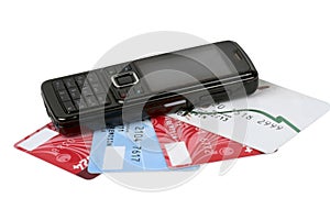 Black cellular telephone on plastic cards