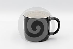 Black ceramic mug standing on white background