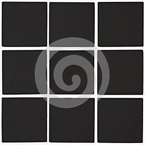 Black ceramic tile with 9 squares in rectangular form with white