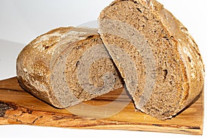 Black cereal bread arranged on a cutting board