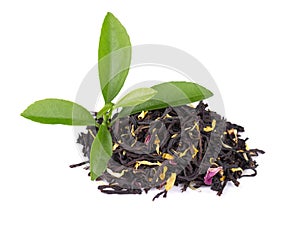 Black ceylon tea with rose petals, cornflowers and sunflower, isolated on white background.