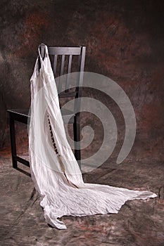 Black chair with white dress