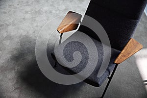 Black chair with wooden railings of unusual shape, top view