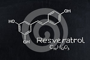 Black chalkboard with the chemical formula of Resveratrol