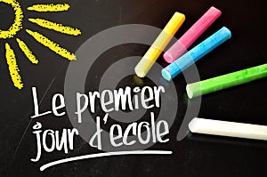 Chalkboard with coloured chalkb and the french words for frist schoolday - le premier jour decole photo