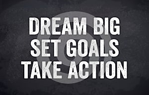 Black chalkboard with dream big, set goals and take action