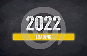 Black chalkboard with yellow loading bar and message Loading 2022