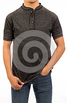 A black charcoal cotton shirt with short sleeve band collar and front placket on a young male model for a casual look