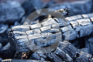 Black charcoal texture background selective focus