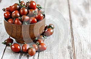 Black cherry tomato background