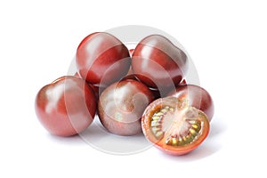 Black cherry tomatoes isolated on white