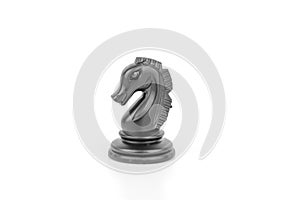 Black chess piece horse isolated on a white background. The concept of board games, logic, training for the brain
