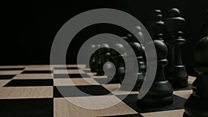 Black chess pieces in start position ready to game concept.