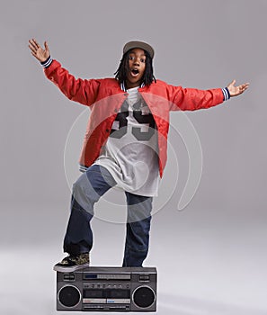 Black child, excited and portrait with radio for hip hop, rap and swag dance with cool clothes in studio. Smile, teen