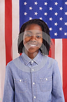 Black child, portrait and American flag background for pride, citizenship and education or learning. Happy face of a