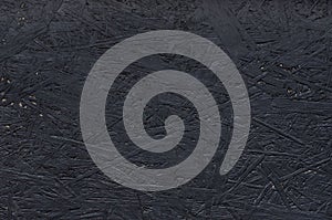 Black chipboard also called particleboard. Background texture. photo