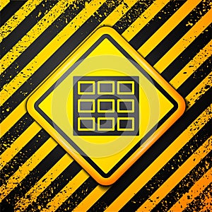 Black Chocolate bar icon isolated on yellow background. Warning sign. Vector