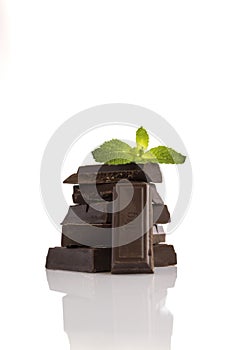 Black chocolate tablets with background. photo