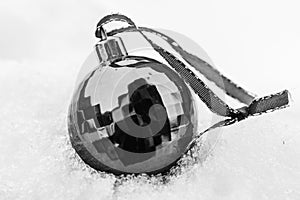 Black Christmas decoration ball isolated on a white background.