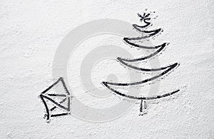 Black Christmas tree and santa house on snowy flour background. Top view