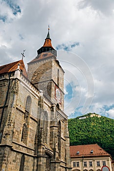 Black Church Biserica Neagra and Tampa mountain in Brasov, Romania photo
