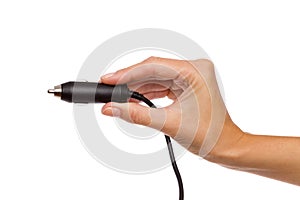 Black cigarette lighter plug in woman's hand