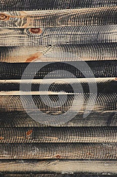 Black circular saw pattern on pine wood slats