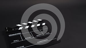 Black Clapperboard or clap board or movie slate use in video production ,film, cinema industry on black background