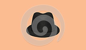 Black classic elegant round hat isolated on brown background