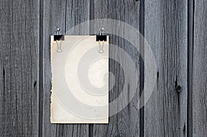 Black clip and old blank note paper hang