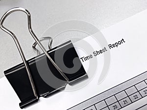 Black clip on the time sheet report