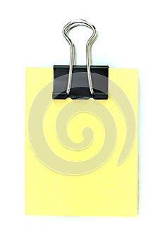 Black clipper and yellow notepad