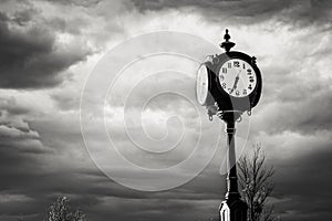 Black Clock at the Crossroads Against a Stormy Sky photo