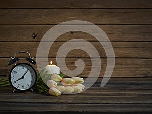 Black clock with tulip bouquet