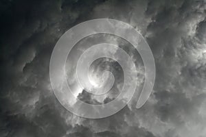 Black clouds in a gray sky threatening the storm