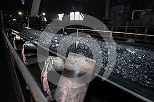 Black coal on a conveyor belt. The production process in the Thermal Power Plant