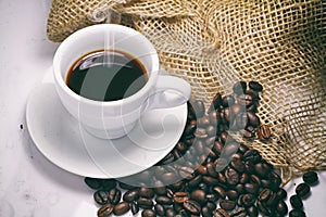 Black coffee beans on white background and effect retro vintage