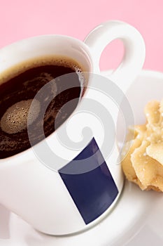 Black coffee with biscuit