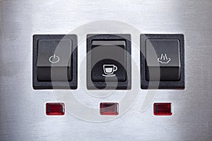 Black coffee brew button with drink cup symbol.