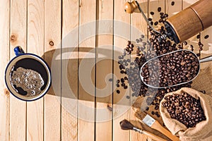 Black coffee and coffee beans on the table wooden background and accessories Ingredients for making coffee. Concepts coffee