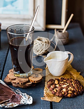 Black coffee cup with biscuits and chocolate