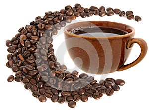 A black coffee cup with brown coffee beans around